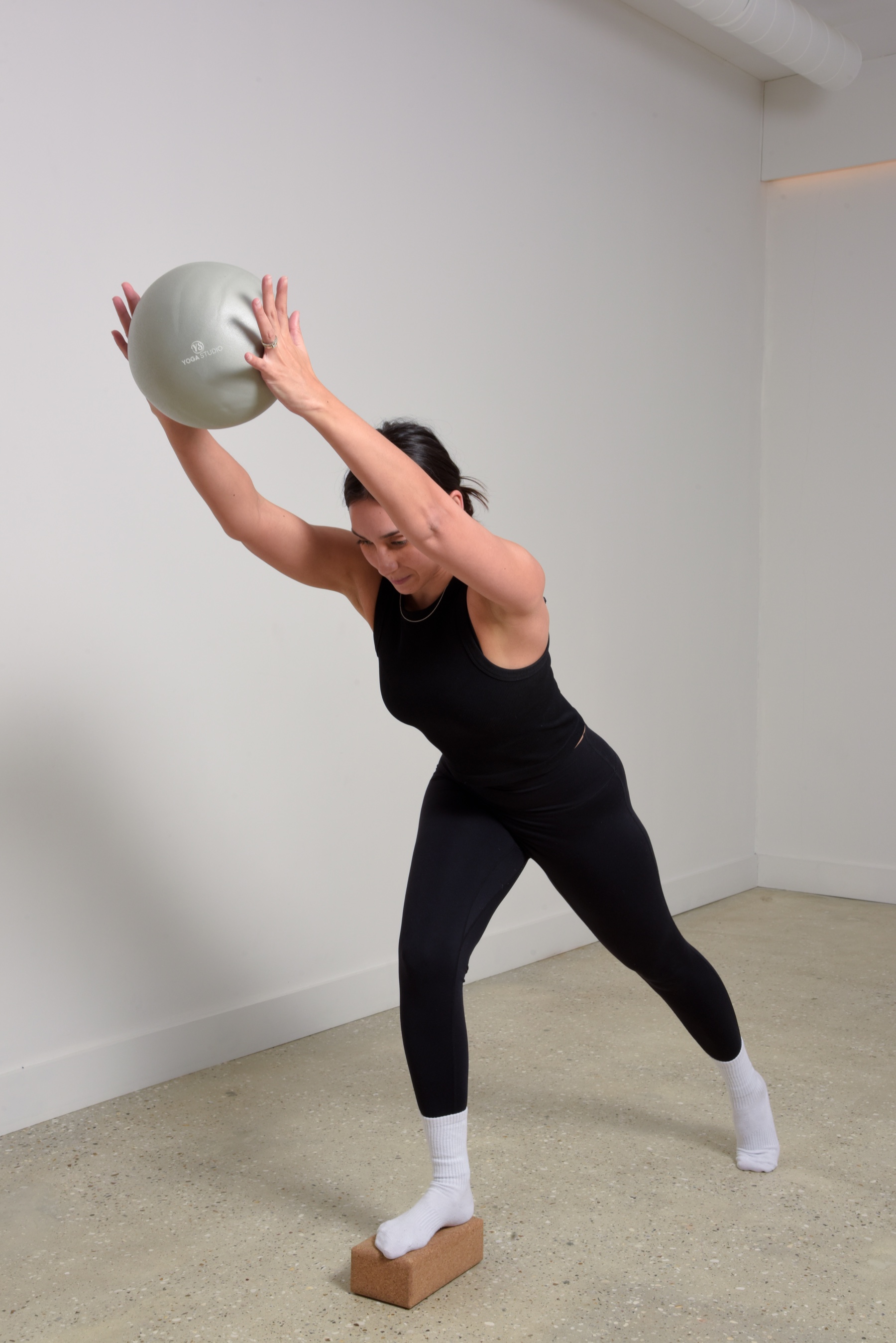 Mubeena practising Pilates with a ball